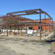 Construction crews worked on the frame of the future New Canaan Post Office Monday afternoon.