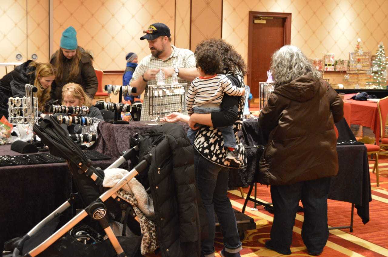 The whole family turns out to shop at the craft fair.