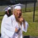 An excited Somers High School 2016 graduate heads to her commencement.