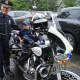Jack tries out a police motorcycle.