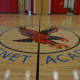 The Fighting Hawk logo adorns the floor of the new gym at Geraldine Claytor Magnet Academy in Bridgeport.