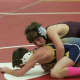 Robert Horan of Ossining (top) on top of Mahopac's Frankie Scauzillo, in a 99-pound bout. 