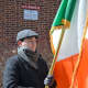 Holding the Irish flag during the Irish national anthem, "The Soldier's Song."