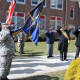 Saluting the flag at Roy W. Brown Middle School before the parade began.