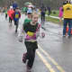 Children run for the finish line at the kids race, which steps off before the Sandy Hook 5K.