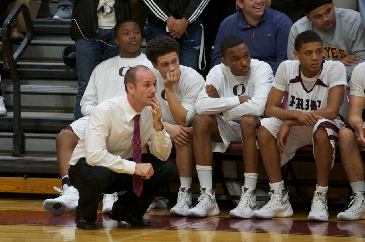 The Ossining bench looks on. 