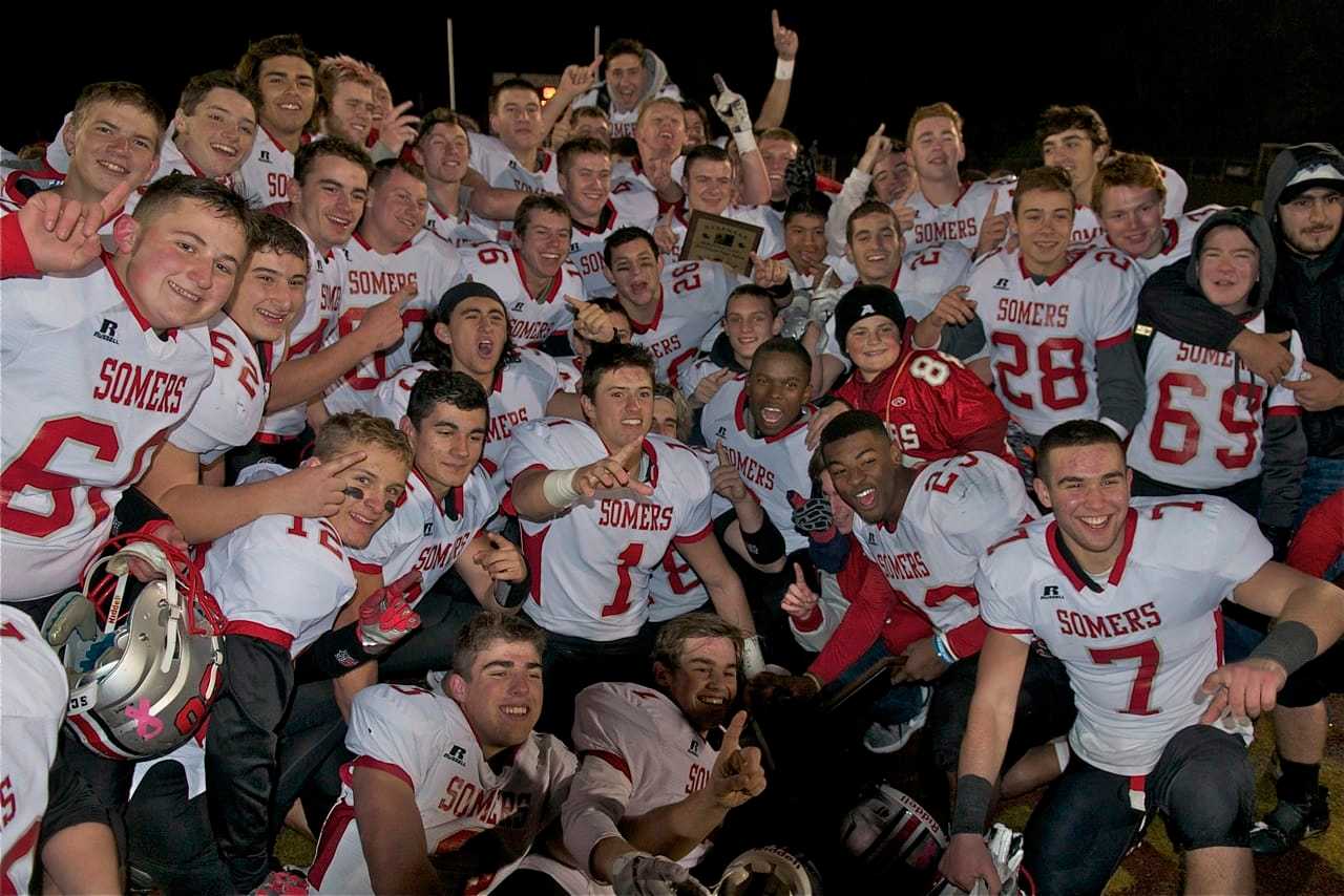 Somers players celebrate after beating Burnt Hills in the New York State Class A semifinal Friday night at Dietz Stadium.
