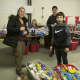 Volunteers prepare items Friday night in Carmel to ship to soldiers overseas.