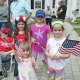 Kids get ready to wave the flag at the Memorial Day Parade in Bethel on Sunday.
