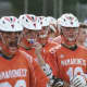 Mamaroneck players watch from the sidelines.