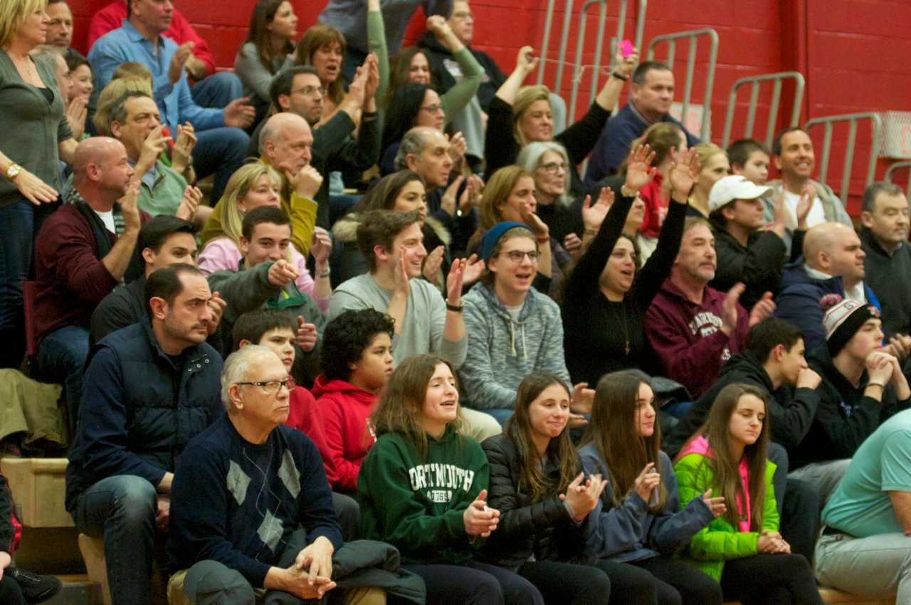 Harrison fans cheer on their team.