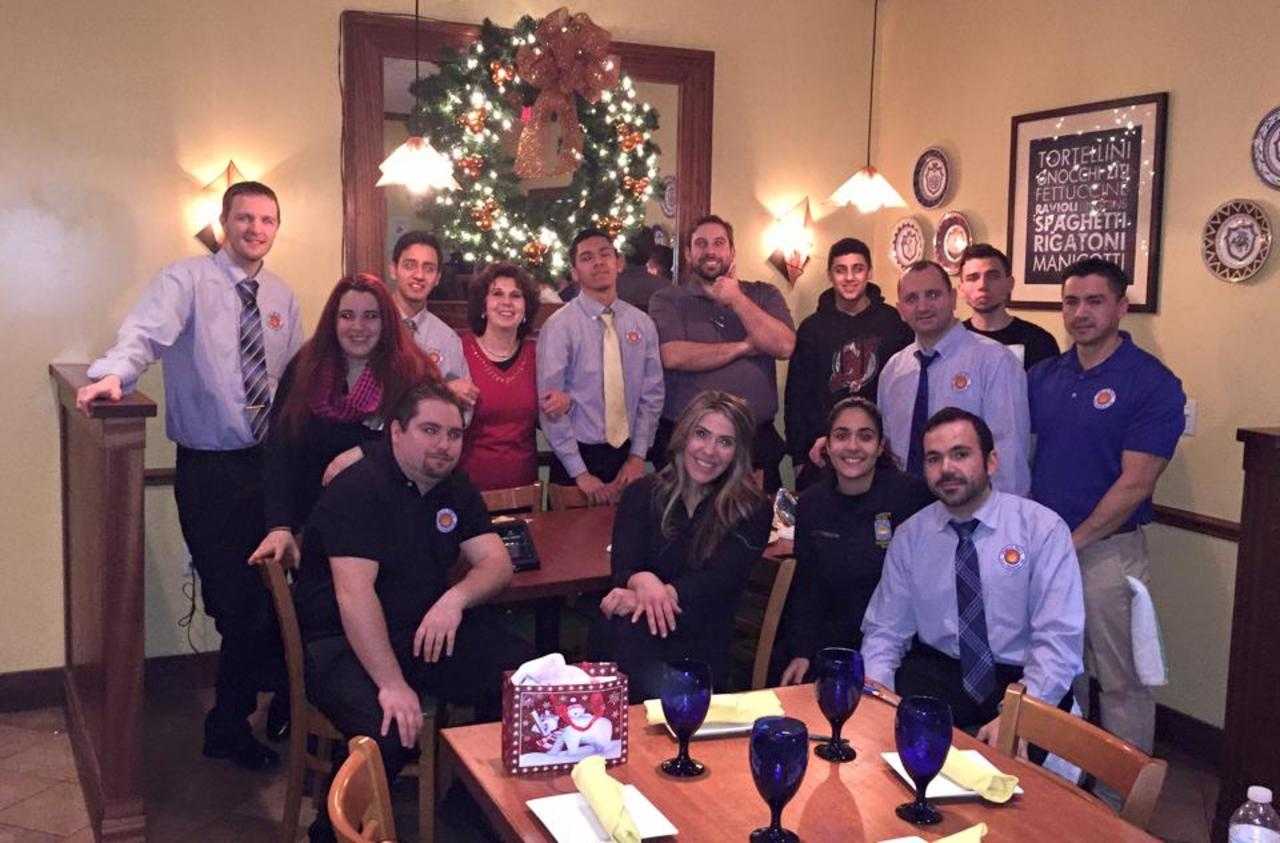 Franco's staff take time out to socialize in the pleasantly appointed dining room. Rear center, Gene Bazzarelli.