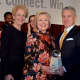 Hillary Clinton, center, with Anthony Justic, BCW Board Chairman, right, and BCW President and CEO Marsha Gordon, left.