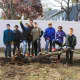 After the felling of the tree, Derek Ravensbergen (tallest, in center) with other scout volunteers.