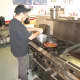 Pat Squillante preparing a hotdog.