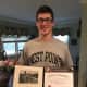 Kevin Moore proudly displays his acceptance certificate to West Point.