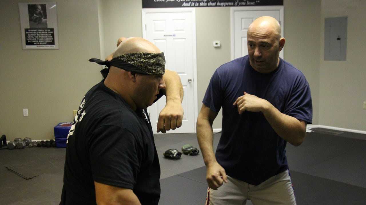 Guy Velella (right) trains one-on-one with Harrington Park Resident Mike Medora (left).