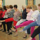 Syncopated Seniors and dance class attendees practice a routine.