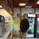 James Magna waits for his order. His son, Hunter, had a pizza making birthday party at the shop a few weeks earlier. 