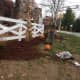 Upper Saddle River DPW worker removed trashed from the flower beds.