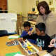 Ossining teacher Micki Lockwood observes her fourth-grade students' Tappan Zee Bridge project.