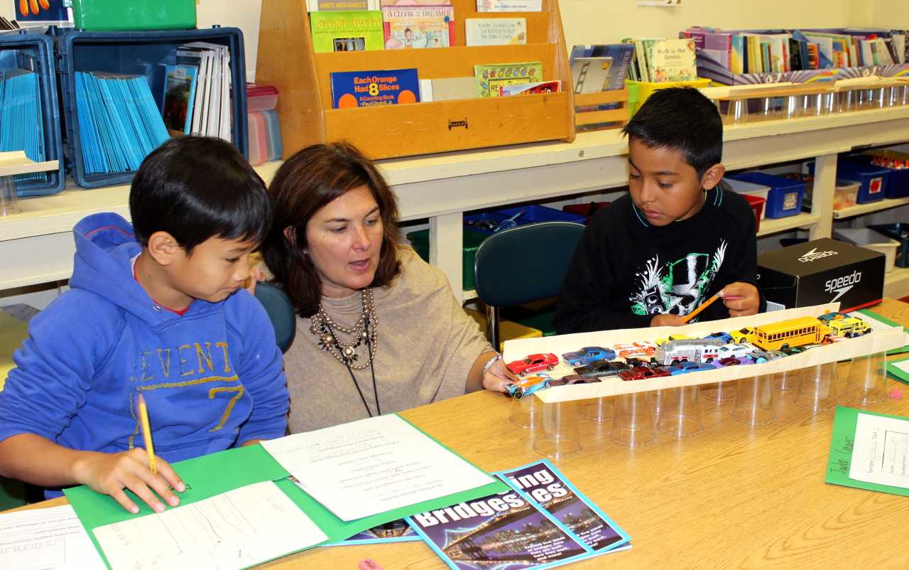 Ossining teacher Micki Lockwood works with her Claremont Elementary School fourth-graders on their Tappan Zee Bridge project.