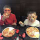 Painted faces AND pizza! Does life get better than that? Two young patrons of Pizza One in Haskell chow down on pies they made themselves.
