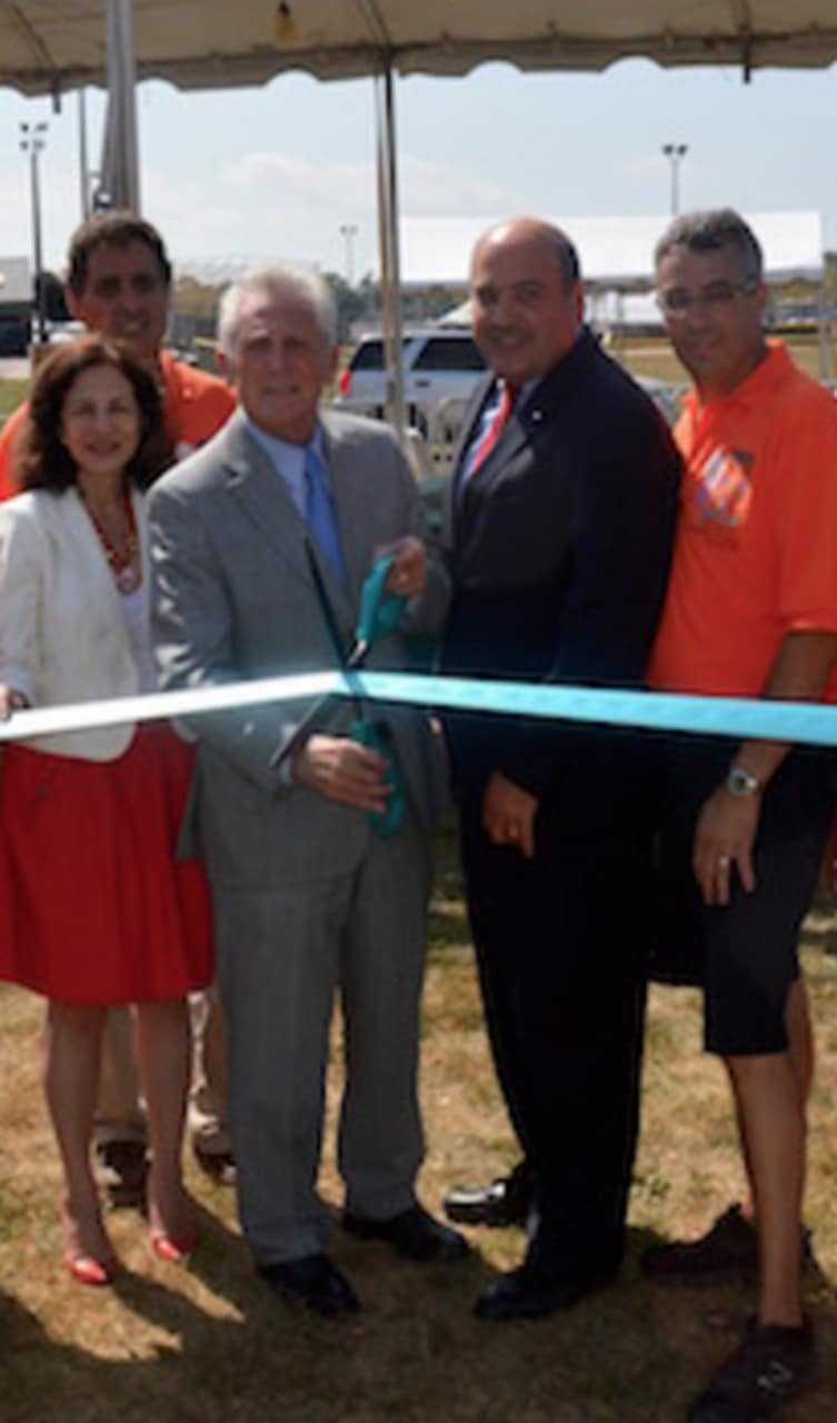 Mayor Harry Rilling is joined by others at the ribbon-cutting for the Norwalk Oyster Festival. See next photo for full IDs. 
