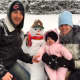 Six-month-old Brianna Mazzone enjoying her first snowfall with parents Mark and Jessica Mazzone. Also pictured is Frosty.