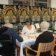 Members of the Adult Day program at The Village enjoy playing cards.