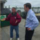 Don Bell of Norm Bloom and Son explains from aspects of the oyster business to U.S. Sen. Chris Murphy during Murphy's tour of the Norwalk business Thursday.