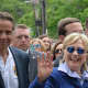 Chappaqua's Hillary Clinton waves as she marches in New Castle's Memorial Day parade. Gov. Andrew Cuomo, who lives in the northern side of town, is pictured at left.