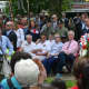 Hillary and Bill Clinton are seated for the town of New Castle's Memorial Day ceremony, which followed the annual parade in downtown Chappaqua.