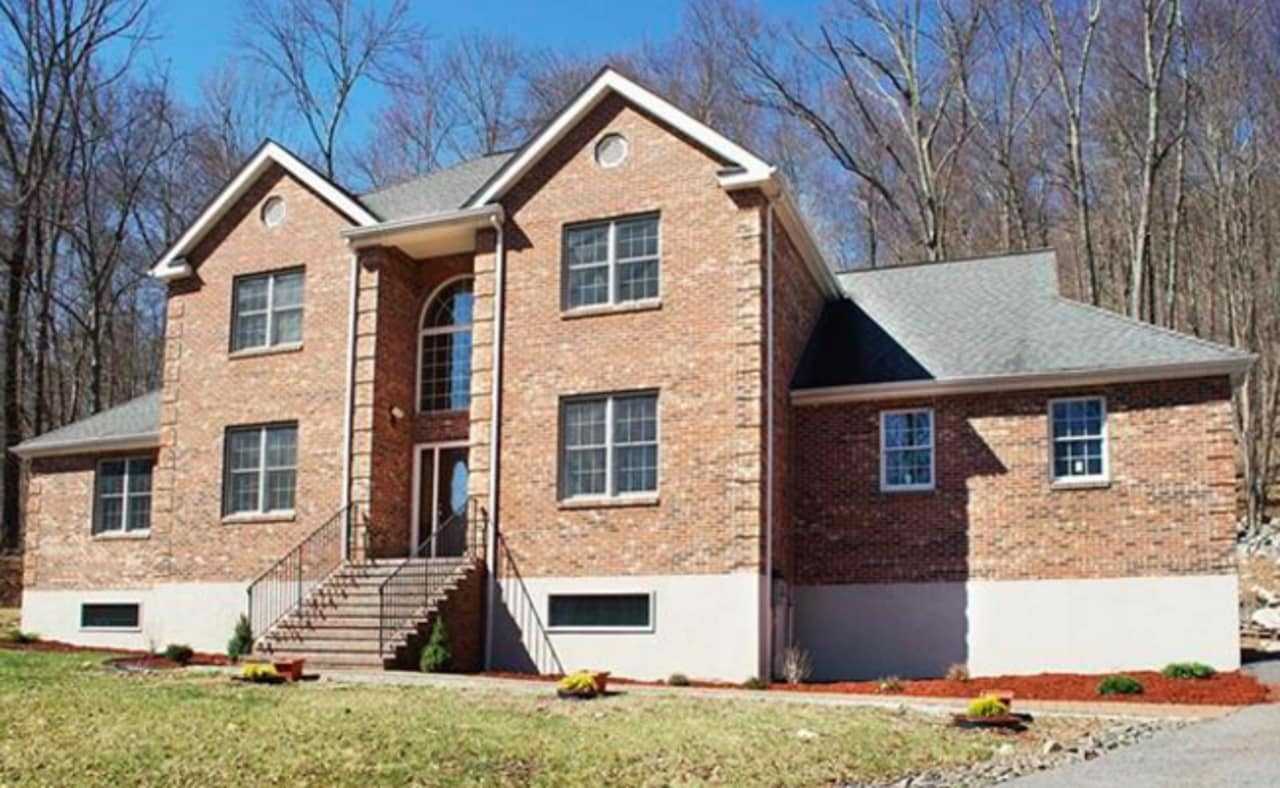A listing at 9 Wiccopee Road is listed by William Raveis agent Anne Savino.