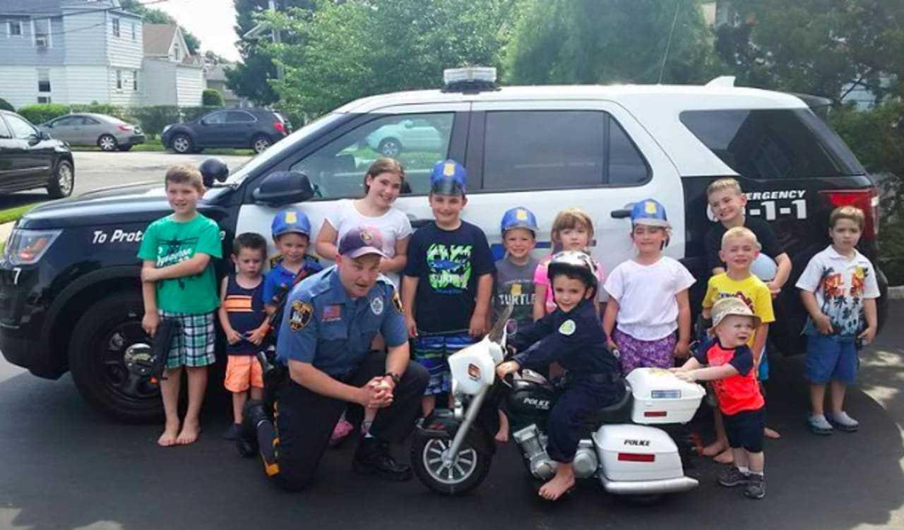 Saddle Brook police officer Christopher Stanton surprised Andrew, 4, at his police-themed birthday party