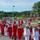 A long line of Somers High School graduates marches toward the 2016 commencement.