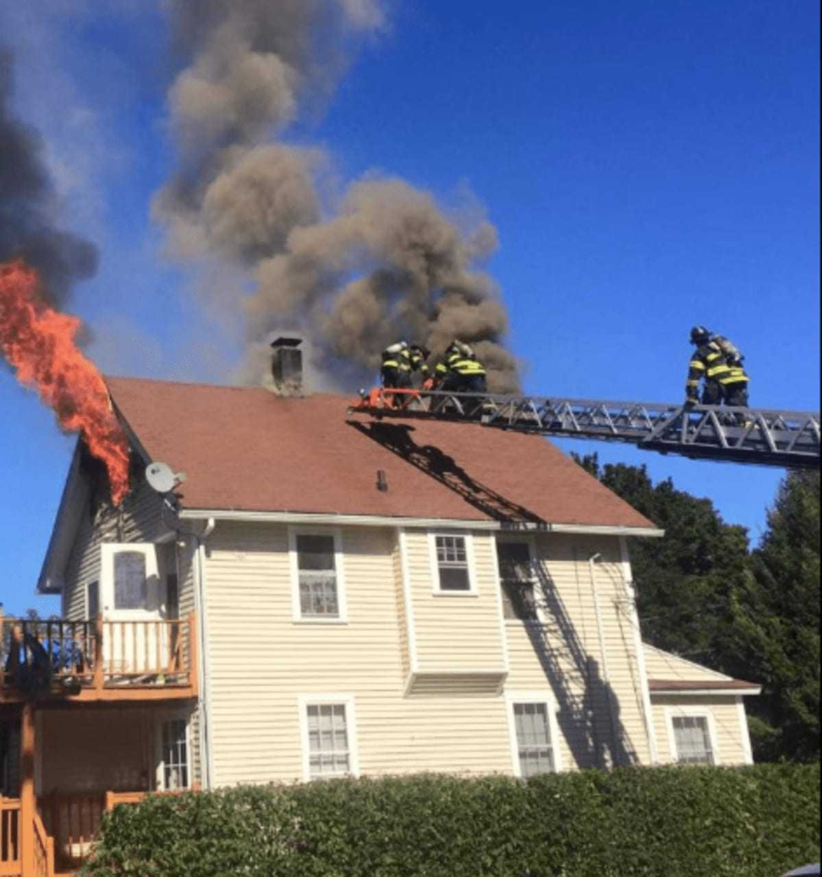 In an image from the Norwalk Fire Department Facebook page, firefighters are seen battling a blaze at 2 Platt St. No one was hurt in the fire in the multifamily home.