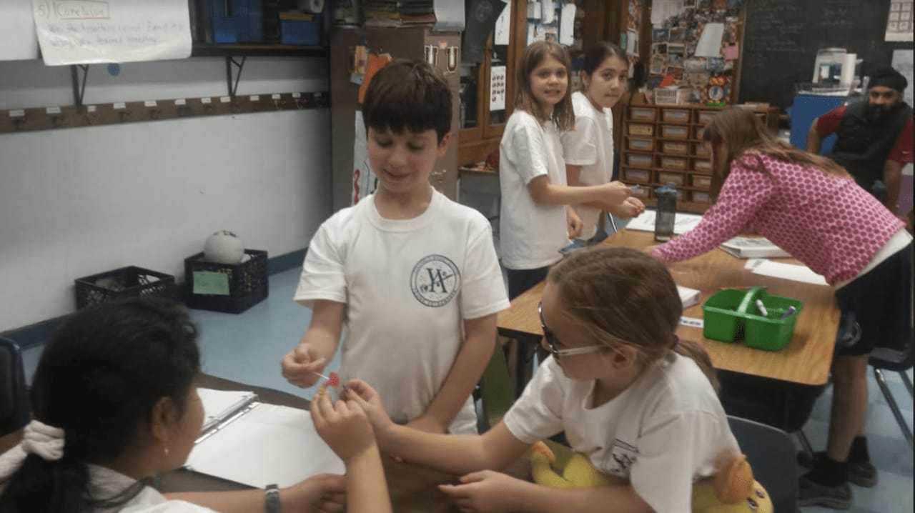 Students in the Young Astronauts Program work on hands-on STEAM activities to complete their mission.