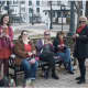 A handful of women talk, laugh and crochete pink pussy hats -- a trademark accessory of the Women's March  -- on Wednesday afternoon in the Bethel Library Courtyard.