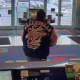 One of two suspects wanted by New Canaan Police for stealing mail Friday is pictured at the TD Bank branch on Friday.