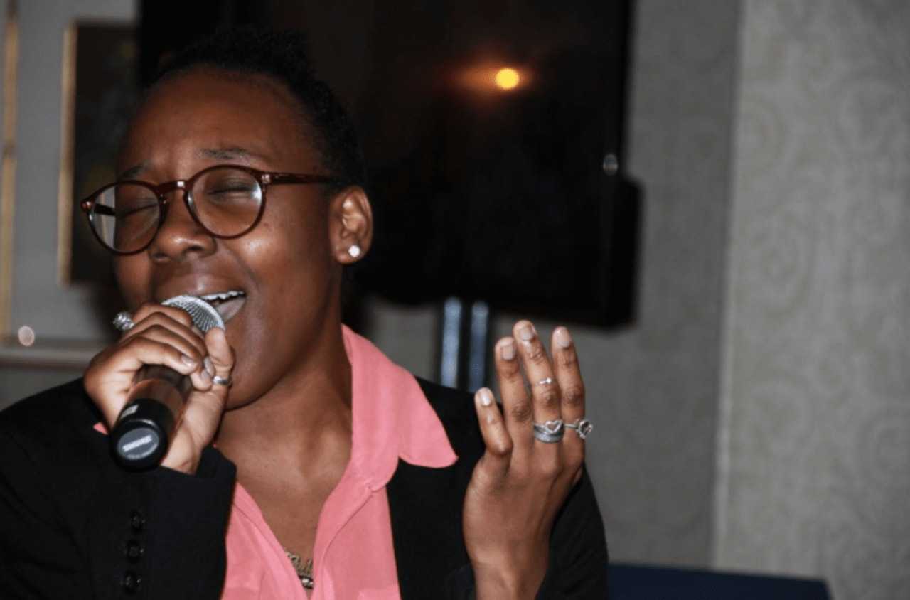 Gabrielle Pierre-Louis, a Carver alumna now studying to be a dentist at the University of Bridgeport, performs at the fundraiser.