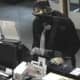 The New Canaan Police Department released new photos of suspects implicated in a bank robbery.