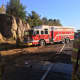 Crews from a local fire department arrive at the scene of a one-car crash on Route 8 in Shelton Friday morning.