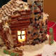 One of the houses in last year's gingerbread decorating contest sported pretzels for walls, candy for chimney stones and lighted windows.