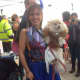 An Ossining resident poses with her dog at the Fall Food and Fashion show on Saturday at Market Square.