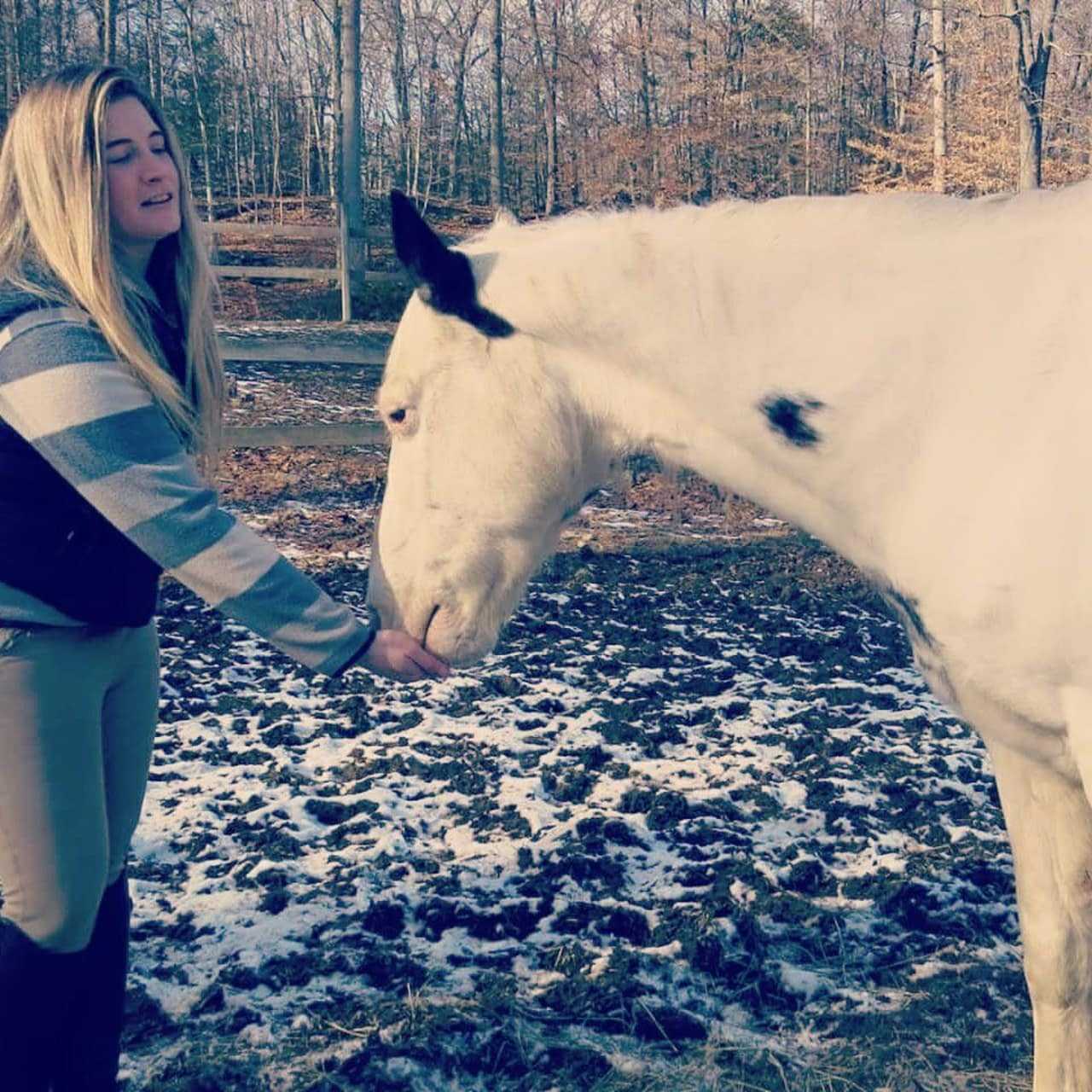 Danielle Cyr gives a treat to Chance.