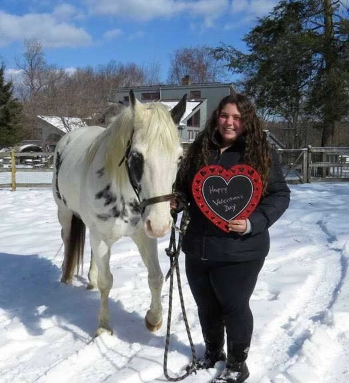 Angelica Cassese holds a Valentine's Day card with Chance.