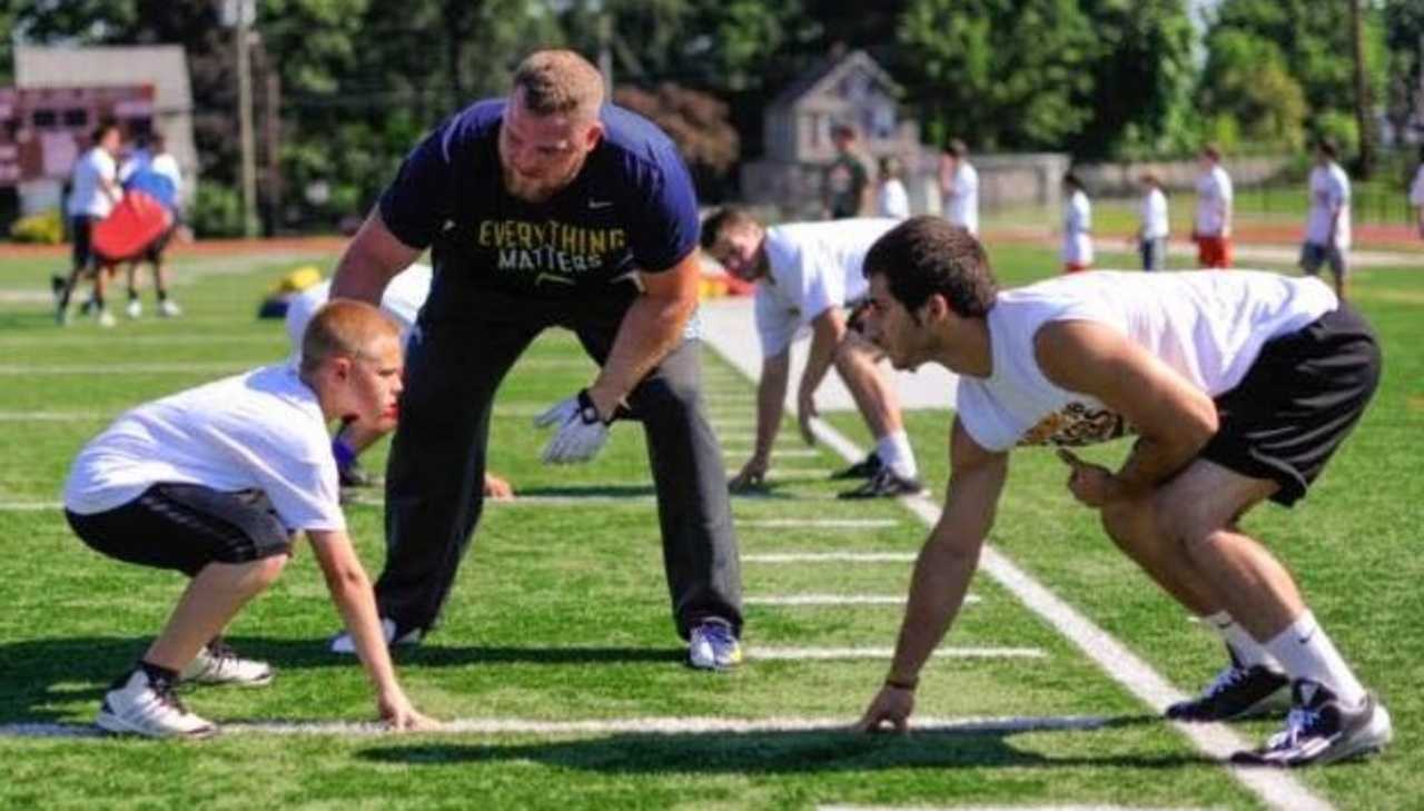 Sean Lissemore instructs youths at camp.