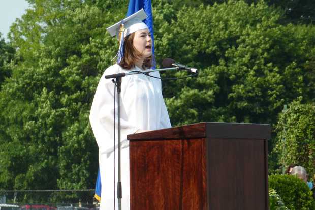 Wilton High School Class of 2013 Valedictorian Paige Wallace addresses her classmates during Saturday's graduation ceremony.