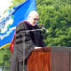 Wilton High School Social Studies teacher Don Schels speaks during Saturday's graduation.